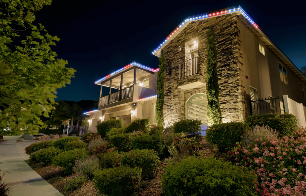 Custom home after outdoor lighting by Starry Night Lights