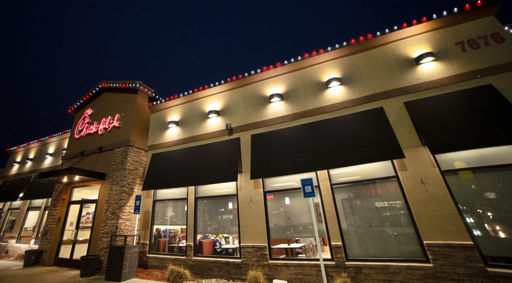 Chick Fil A building with red and white LED lights along the roofline