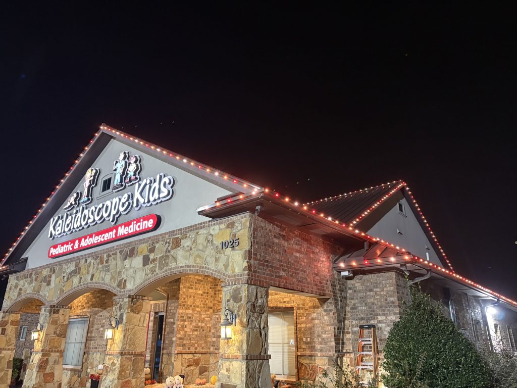 Office with warm colored LED lights along its rooflines