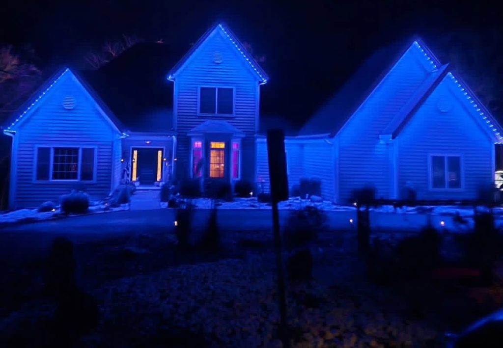 Home with Lumenary Pro down facing roofline lighting showing a total blue color wash installed by Starry Night Lights